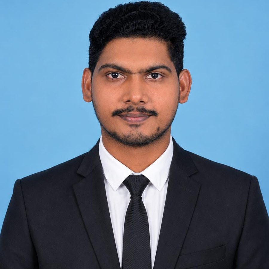 Portrait of Rahman Sharif M in a black suit